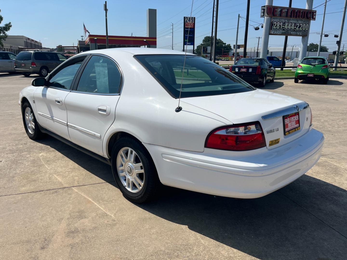 2004 white /TAN Mercury Sable LS Premium (1MEHM55S54A) with an 3.0L V6 SOHC 24V engine, 4-Speed Automatic Overdrive transmission, located at 14700 Tomball Parkway 249, Houston, TX, 77086, (281) 444-2200, 29.928619, -95.504074 - Photo#4